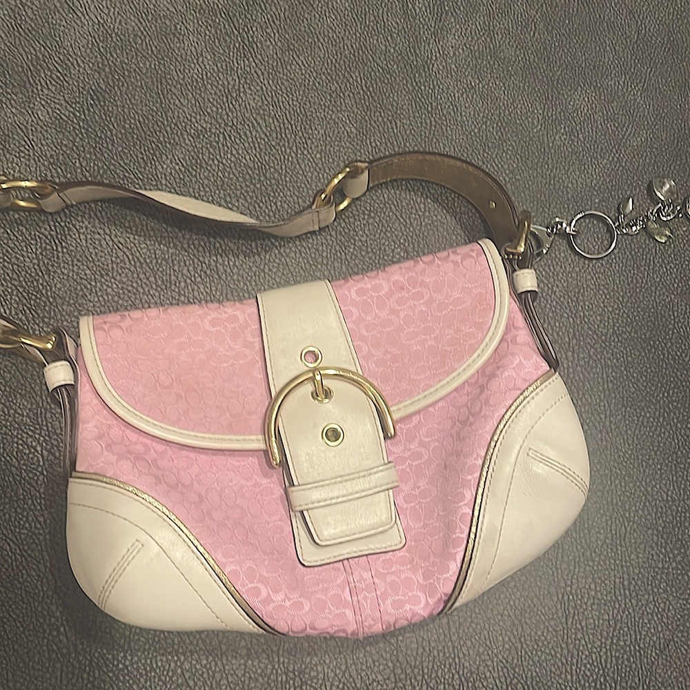 Coach pink small hobo with gold accents.